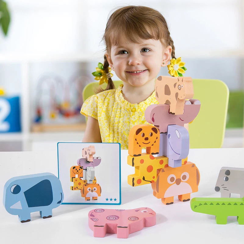 Child playing with colorful animal-shaped building blocks on a table.