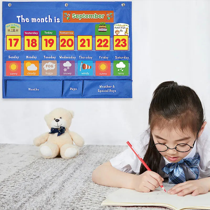 Child writing at a desk with a calendar hanging on the wall