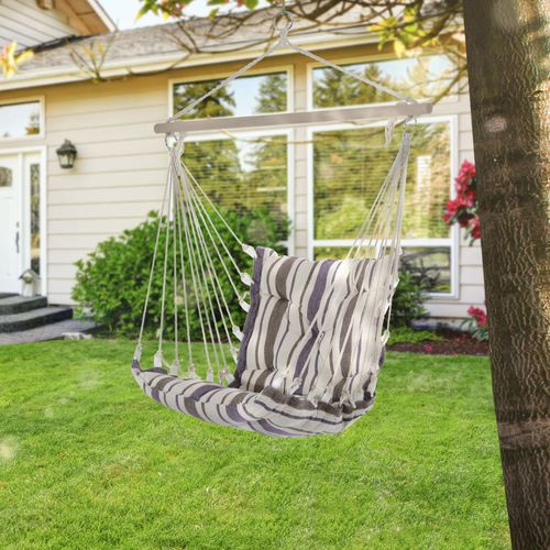 Swing chair in calm indoor setting with warm lighting, promoting gentle movement and emotional regulation.