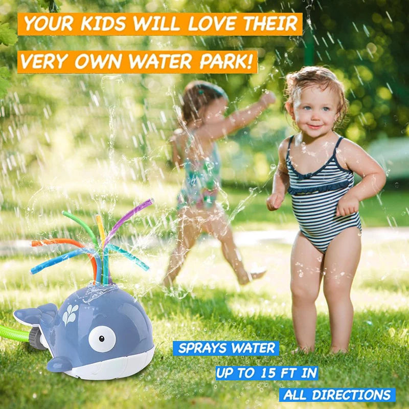 Child running through outdoor water spray sprinkler t