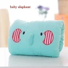 Plush hand mitt pillow in soft colours designed to cradle hands and support tactile relaxation