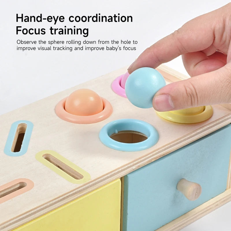 Wooden toy box containing sensory tools and educational play pieces