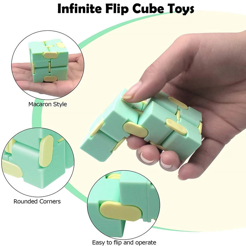 Green Infinite Flip Cube Toys with rounded corners held by a hand, on a light yellow background.