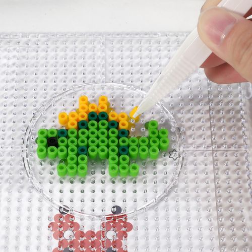 Children using bead kit in calm crafting session, ideal for neurodivergent focus and visual engagement.”