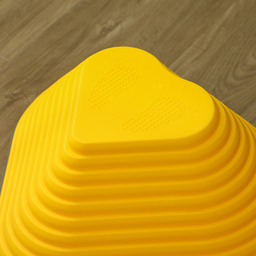 Close-up of anti-slip edge on vibrant stepping stone placed on smooth indoor flooring