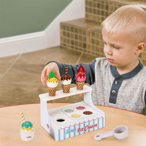 Child using mini cone and scoop set to build social sequencing and descriptive language skills