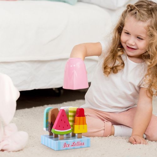 Children using colourful ice lolly toy set during collaborative role play session