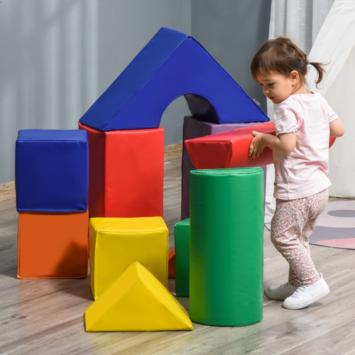 Child playing with foam stacking pieces to build coordination, logic and creative play skills