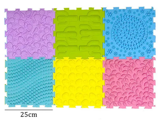 Colorful interlocking plastic mats on a white background with a size label of 25cm.