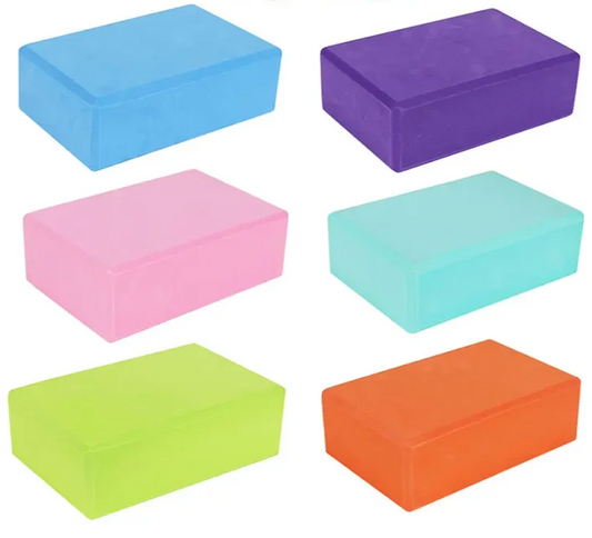 Set of six colorful yoga blocks on a white background