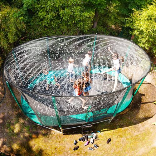 VINSANI trampoline sprinkler wrapped around trampoline frame, releasing gentle summer mist for active sensory play