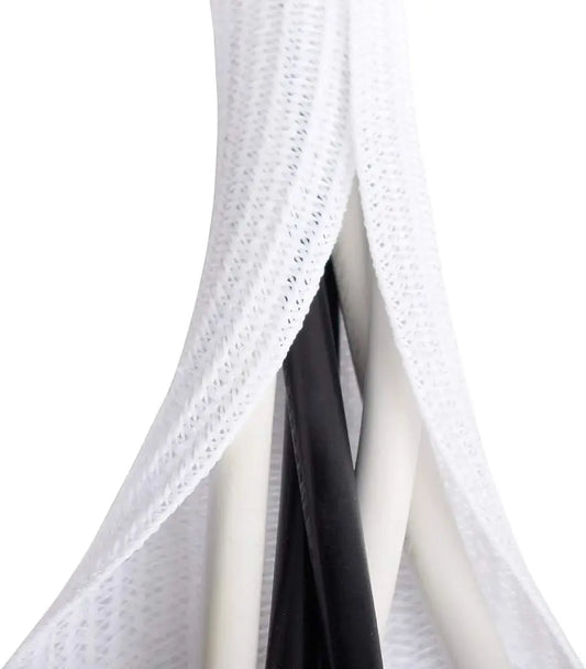 White cable sleeve coiled neatly, shown wrapped around multiple wires to reduce clutter and improve safety