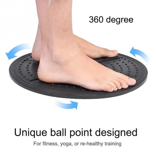 A person standing on a black balance board with a 360-degree rotation label, indicating the board's capacity for full range of motion.