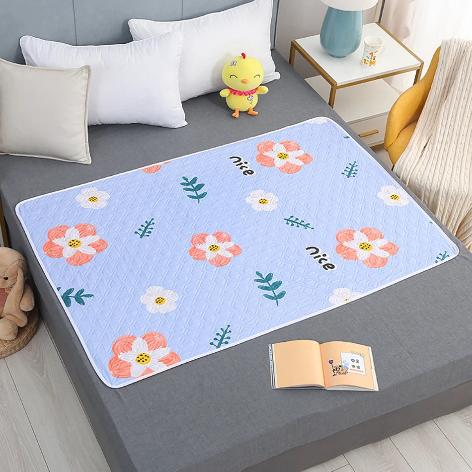 Large waterproof changing pad made from soft, breathable fabric in a folded view for sensory-safe hygiene protection