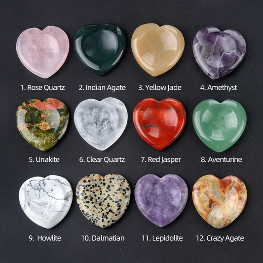 Heart-shaped stones of various colors and names on a dark background