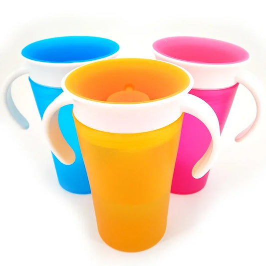 Three colorful plastic cups with handles on a white background