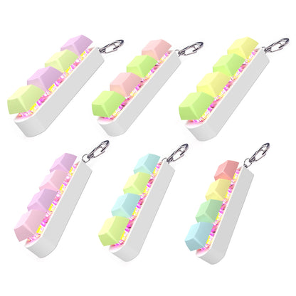 Compact mechanical keyboard fidget tool with LED glow for calming sensory input
