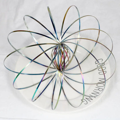 Toroflux flow ring spiralling smoothly down adult arm for tactile focus