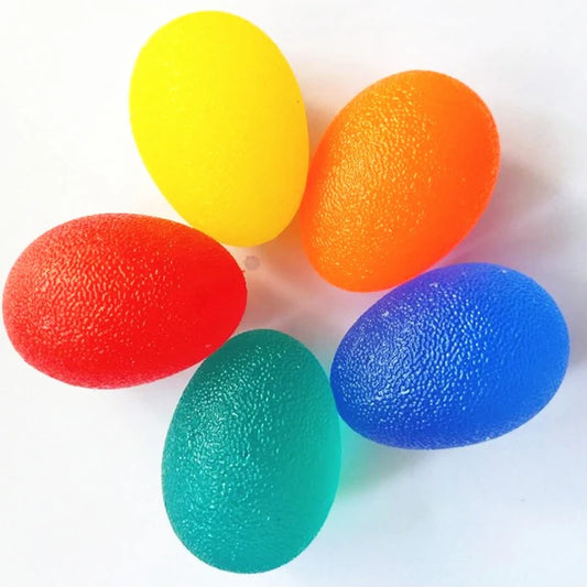 Five colorful stress balls (yellow, orange, red, green, blue) on a white background