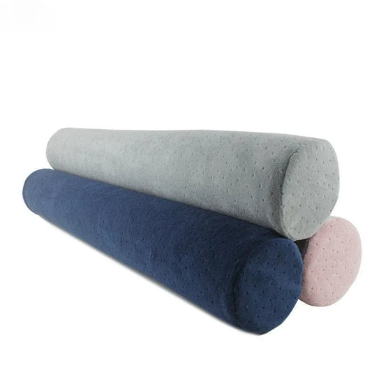 Long cylindrical bolster pillow in neutral fabric, ideal for sensory-friendly support, lounging and positional comfort