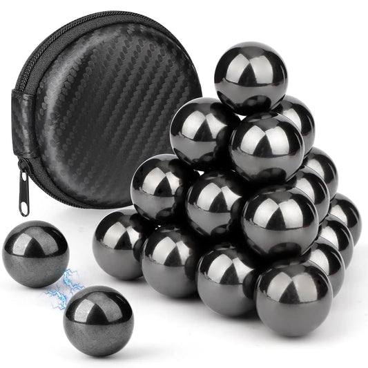 Set of black metal balls with a black case on a white background