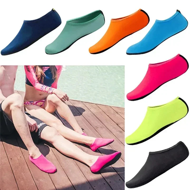 Unisex water shoes on sandy beach, showing non-slip sole and breathable mesh