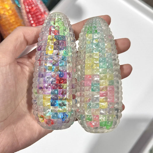 Corn-shaped squishy sensory toy offering slow-rebound tactile support