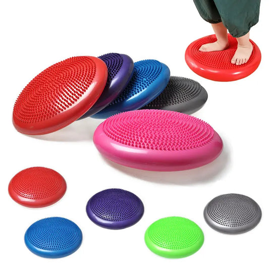 Inflatable wobble cushion shown on chair seat with manual pump beside, textured surface for balance and core engagement