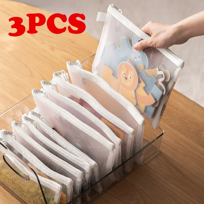 Three toy storage bags in assorted sizes, shown upright with soft handles and spacious interiors for organised play