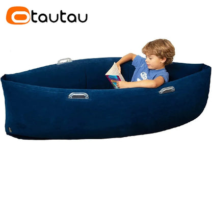 4FT inflatable sensory peapod nest inflated on carpet with child seated inside hugging the sides in soft green PVC