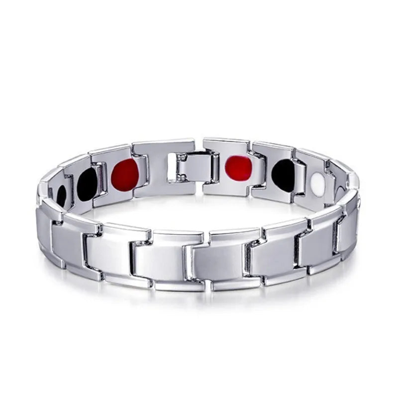 Silver bracelet with black and red circular elements on a white background
