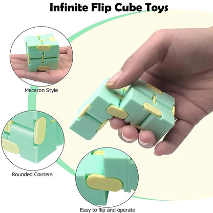 Green Infinite Flip Cube Toys with rounded corners held by a hand, on a light yellow background.
