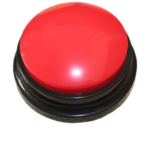 Red voice recording button shown on desk beside instruction card, compact and tactile for accessible use