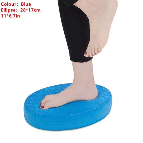Soft balance pad in blue TPE foam, shown on exercise mat for sensory-friendly stretching and core work