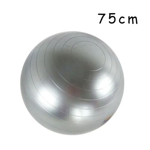 Grey yoga ball used during sensory regulation exercises in home therapy space.