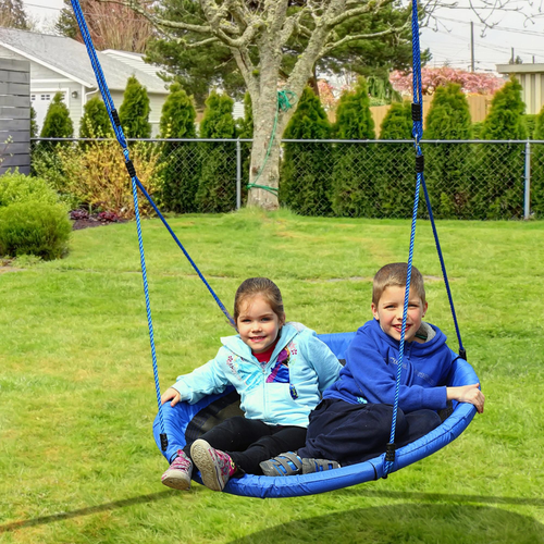 Child using 100cm nest-style swing to practise balance and imaginative movement routines