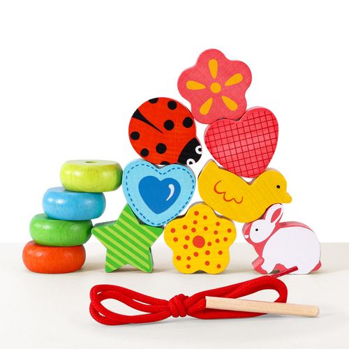 Bright blocks with lacing string supporting fine motor skills and visual exploration