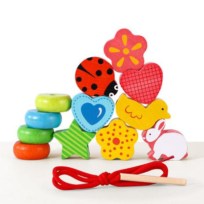 Bright blocks with lacing string supporting fine motor skills and visual exploration
