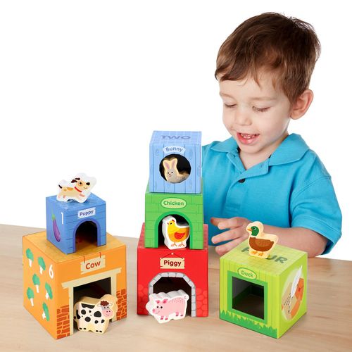 Child playing with stacking blocks to build spatial awareness and colour recognition