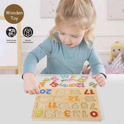 Child placing patterned number tile into board to practise counting and fine motor coordination