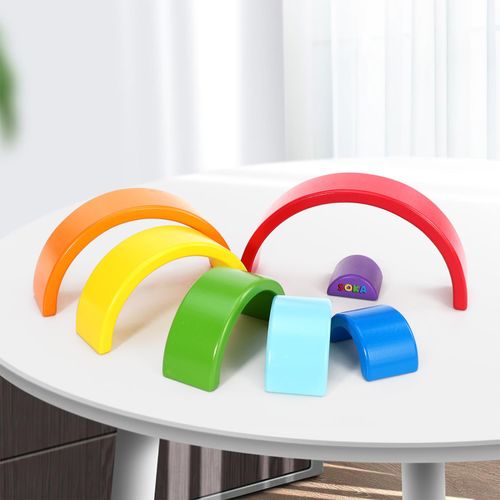 SOKA rainbow stacker with seven colourful wooden arches arranged for sequencing play